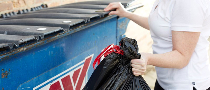 woman-taking-trash-out