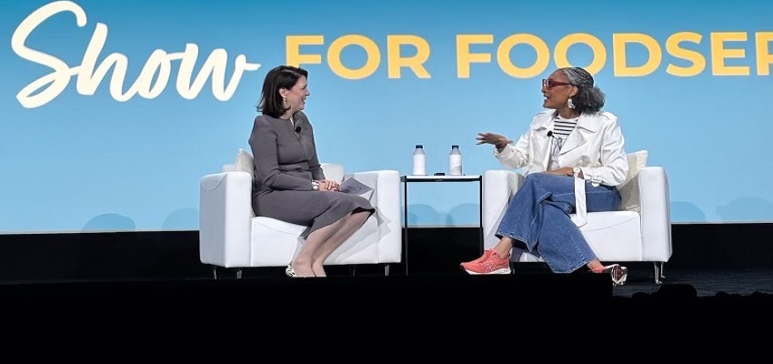 CEO Michelle Korsmo with chef Carla Hall on stage at 2025 restaurant show