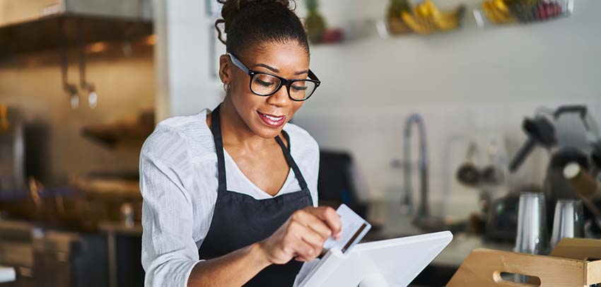 Woman slipping a credit card 