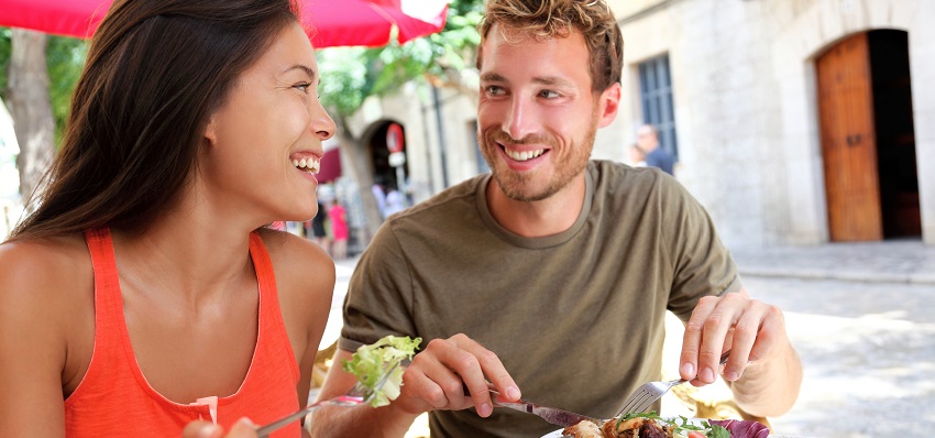 Couple eating outdoors