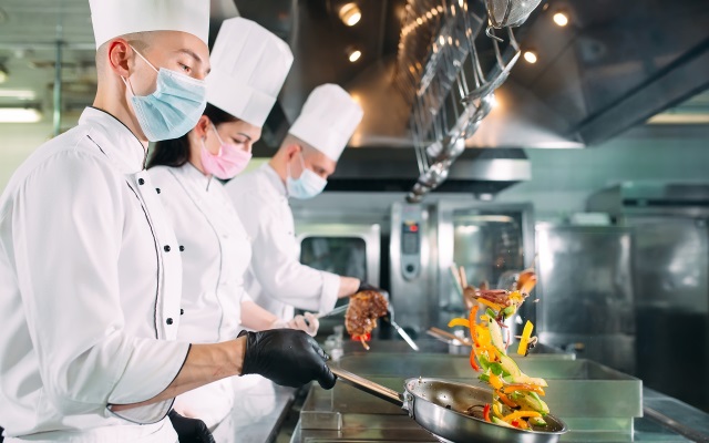 Three chefs in the kitchen