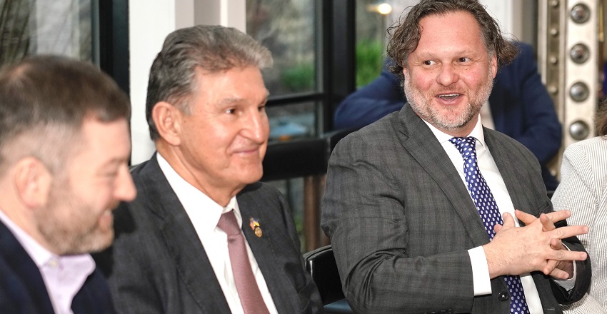 The Association's Matt Walker, left, with Sen. Manchin, center, and David Asam of the Bavarian Inn.