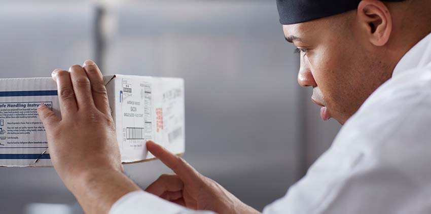 Man looking at a box